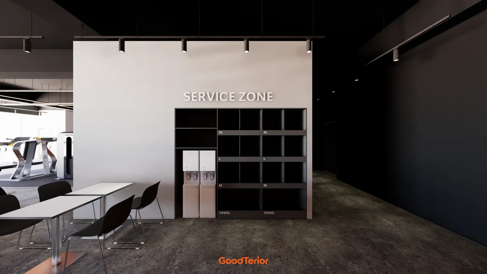 Black gym service cabinet with clothing sizes and TOWEL labels, beside water dispensers and break tables